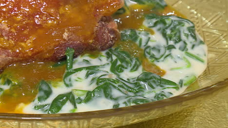 crispy orange glazed pork with creamy spinach