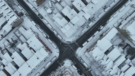 city intersection in usa in snow covered american town after snowstorm