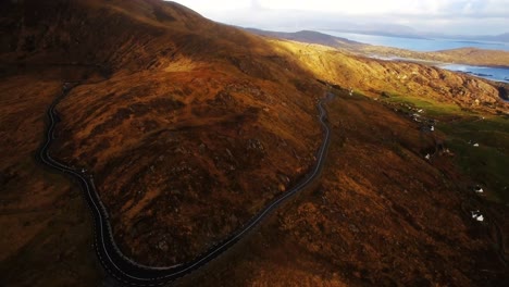 Aerial-view-of-road-passing-through-mountain-4k