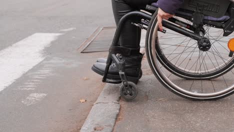 a person with a disability moves along the street in a wheelchair, the border prevents the movement of the wheelchair