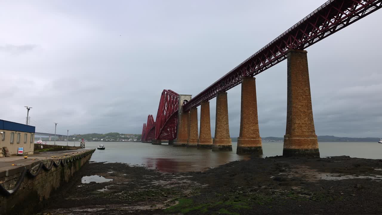 wide-angle shot of the famous Queensferry bridges on a cloudy day