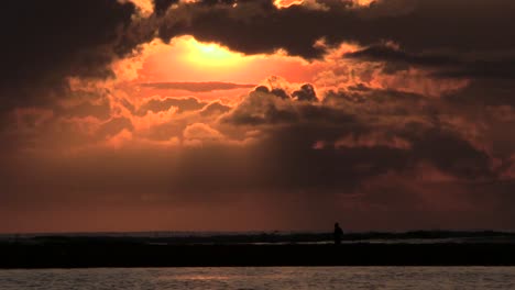 Sunrise-with-clouds-and-fisherman-spear-tarraya-with-the-lagoon-and-sea-in-the-background