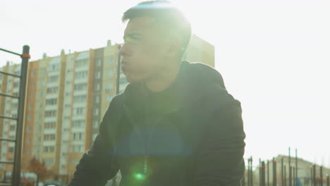 man drinking water after outdoor workout