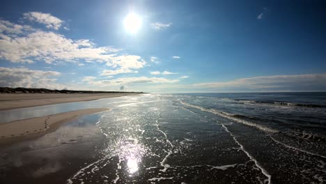 lateral view of waves crashing on the shore