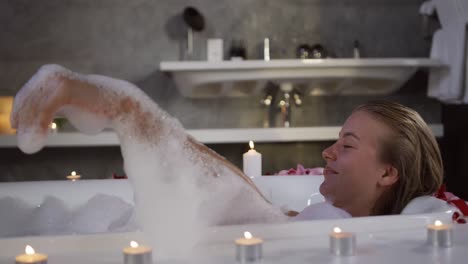 Caucasian-woman-taking-bath-in-hotel