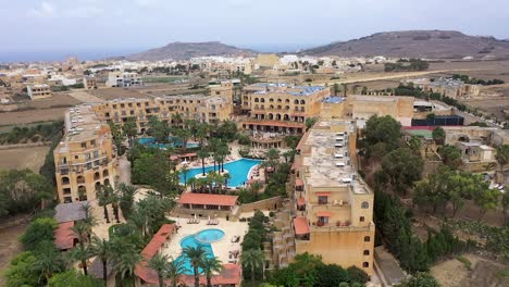drone flight over a hotel complex and its surrounding area over the maltese island of gozo