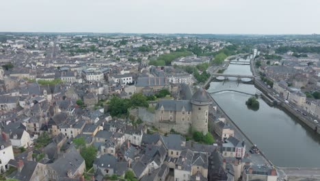 Aerial horizontal panoramic drone shot of Laval city center, in Mayenne, France. Flying over the quays of the Mayenne river. Tourism sightseeing  landmarks
