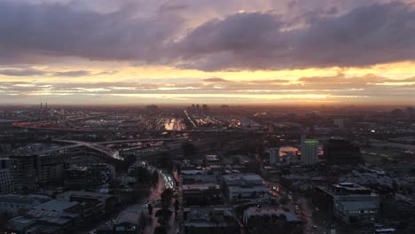 aerial shot of west melbourne on a beautiful moody sunset evening with traffic and city views