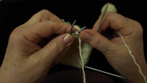 Grandmother Artisan Handcrafting Traditional Socks with Spears, Natural Sheep&#039;s Wool, Yarn Skeins