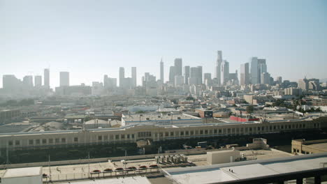 city skyline views from a high-rise balcony overlooking urban and industrial areas