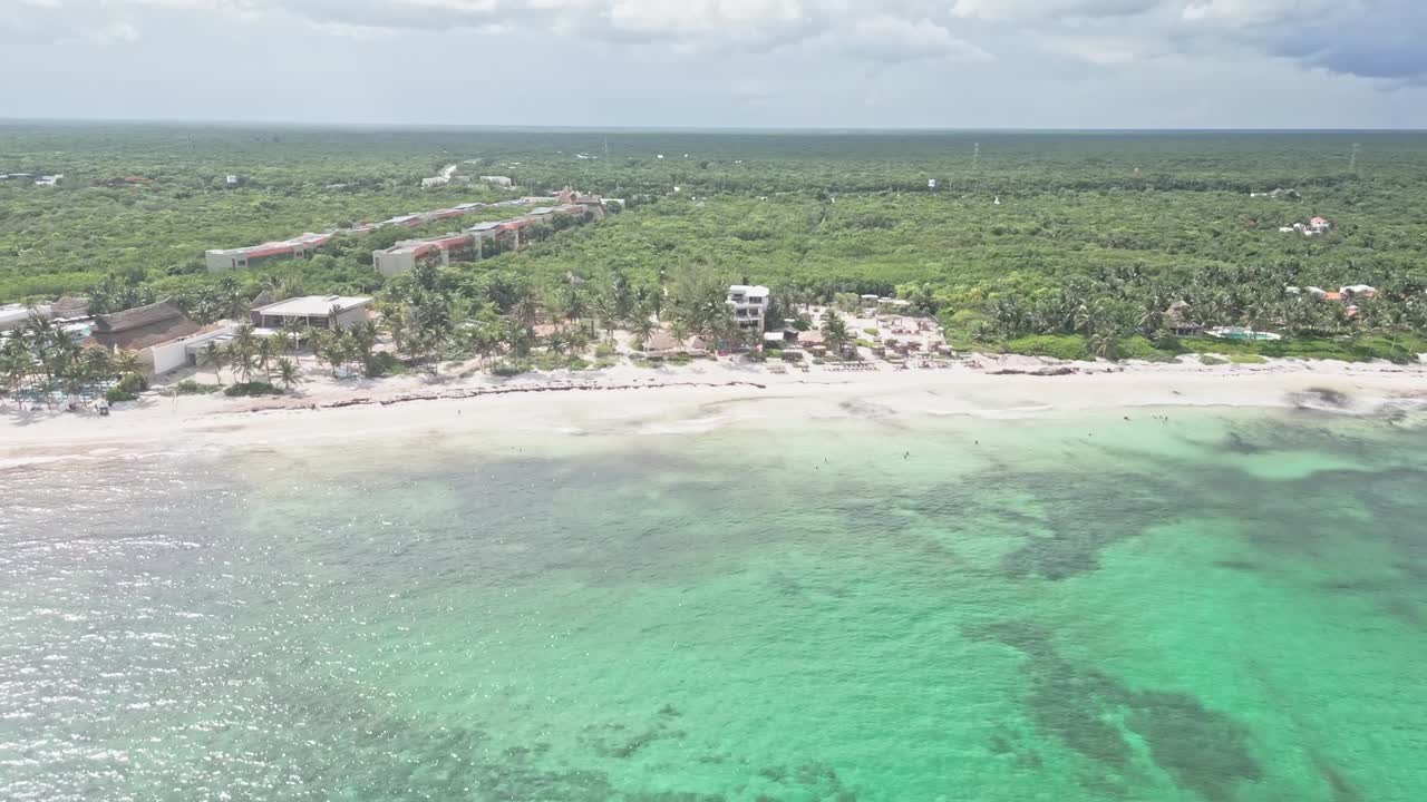 Sunny Xpu-Ha beach, turquoise sea, lush forest, Riviera Maya Mexico