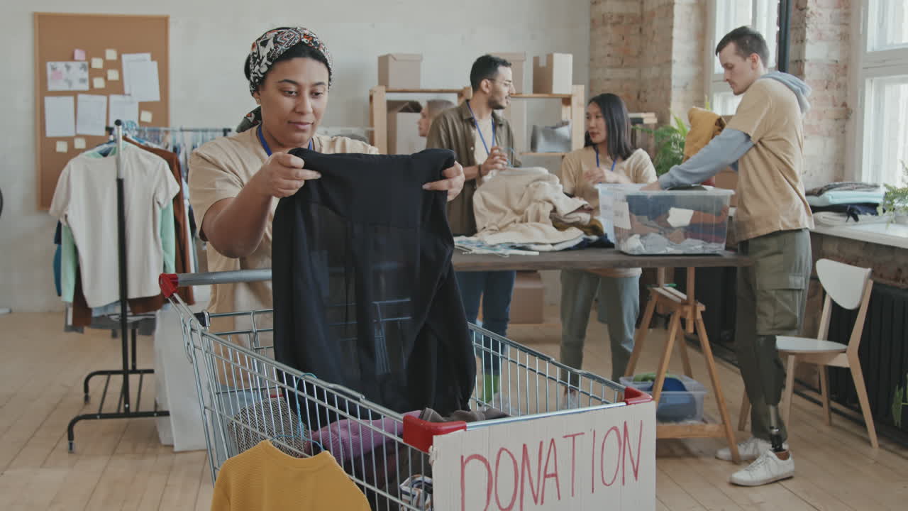 Portrait of Female Volunteer with Donated Clothes