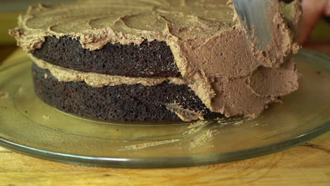 Slow-motion-clip-of-frosting-a-delicious-two-layer-chocolate-cake