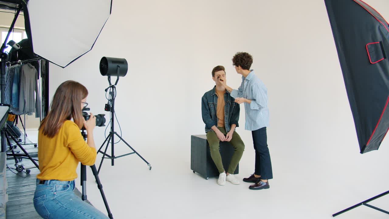 Fashion photoshoot with makeup artist and model