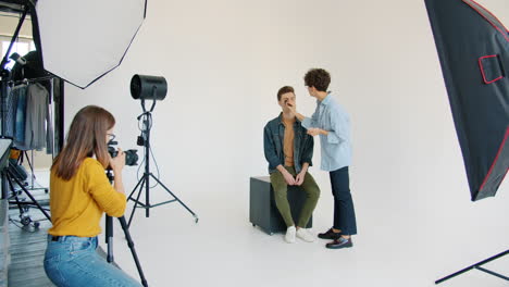 fashion photoshoot with makeup artist and model