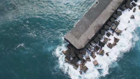 Bird's-Eye-Shot-Of-Isolated-Pier-Surrounded-With-Sea-Water,-Puerto-De-La-Cruz,-Spain