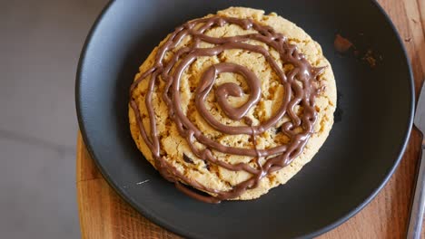 chocolate drizzled cookie on a plate