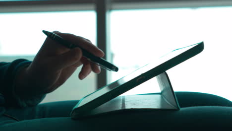 woman using pen to work with touch pad