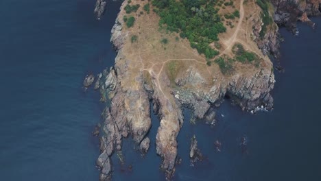 beautiful rocks with blue sea shot from high