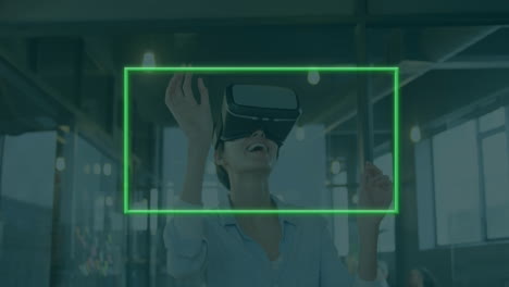 animation of neon frame over caucasian woman using vr headset in office