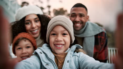 a happy family takes a selfie together on a winter day