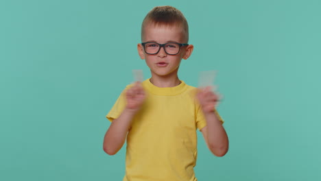 displeased toddler children boy shakes finger and saying no, be careful, scolding and avoid danger