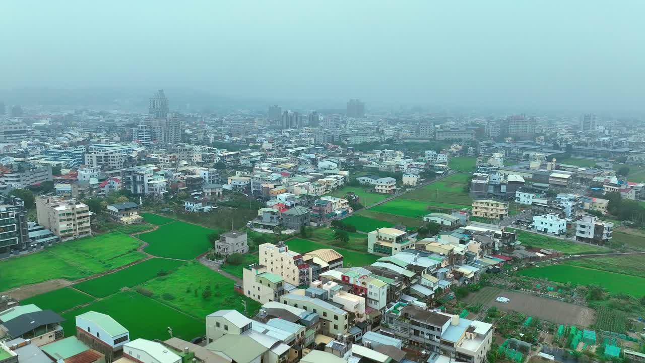 Ascend flight over miaoli city in Taiwan during foggy and cloudy morning, taiwan