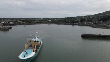 Fishing-boat-setting-sail-from-a-small-harbour