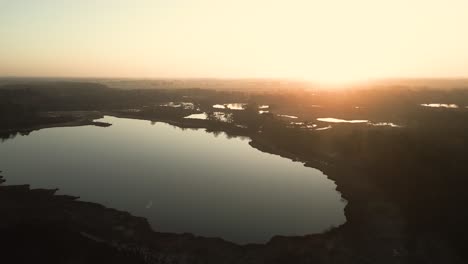 sunrise over a misty wetland landscape
