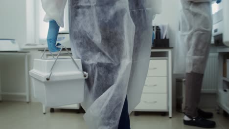 scientist carrying equipment in a laboratory