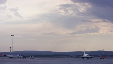 airplane at airport at sunset/sunrise