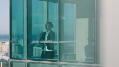 successful business woman looking out window planning ahead thinking of future enjoying view of city 4k footage