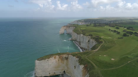 porte d'amont arch, cliff rock formation in etretat coastline, aerial