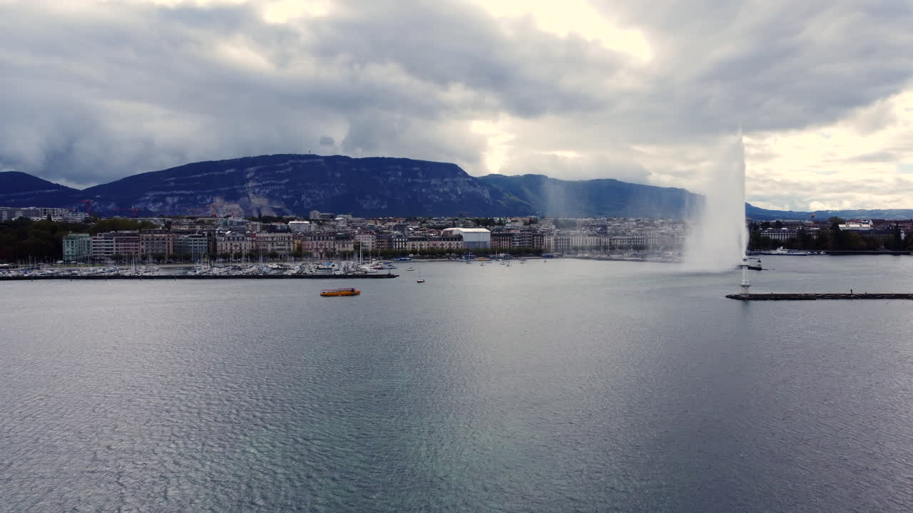 Taxi Boat Lake Geneva City Background with Jet d'Eau Fountain AERIAL