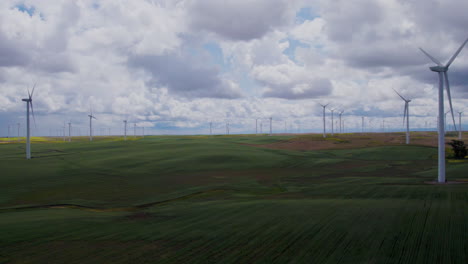 4k-Slow-motion-aerial-footage-of-windmills-over-agricultural-land-in-california