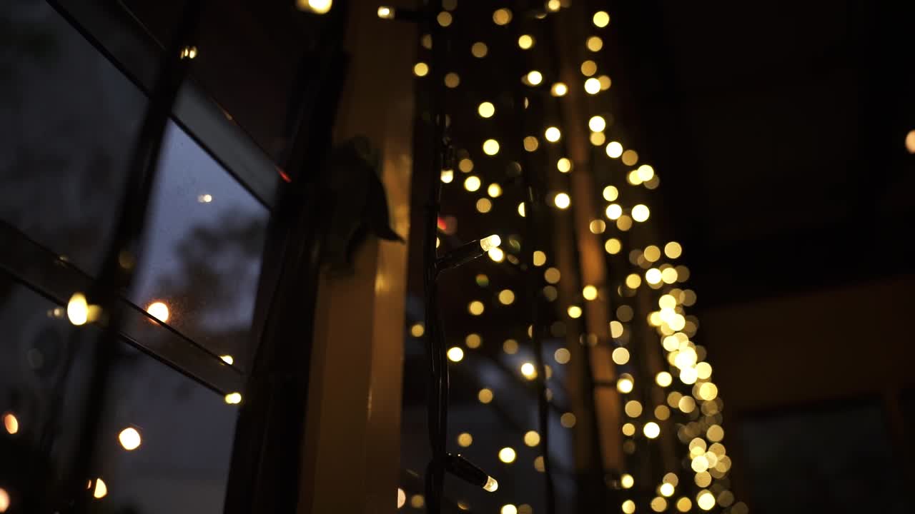 Fairy Lights Hanging In The Window, Illuminated At Night - close up