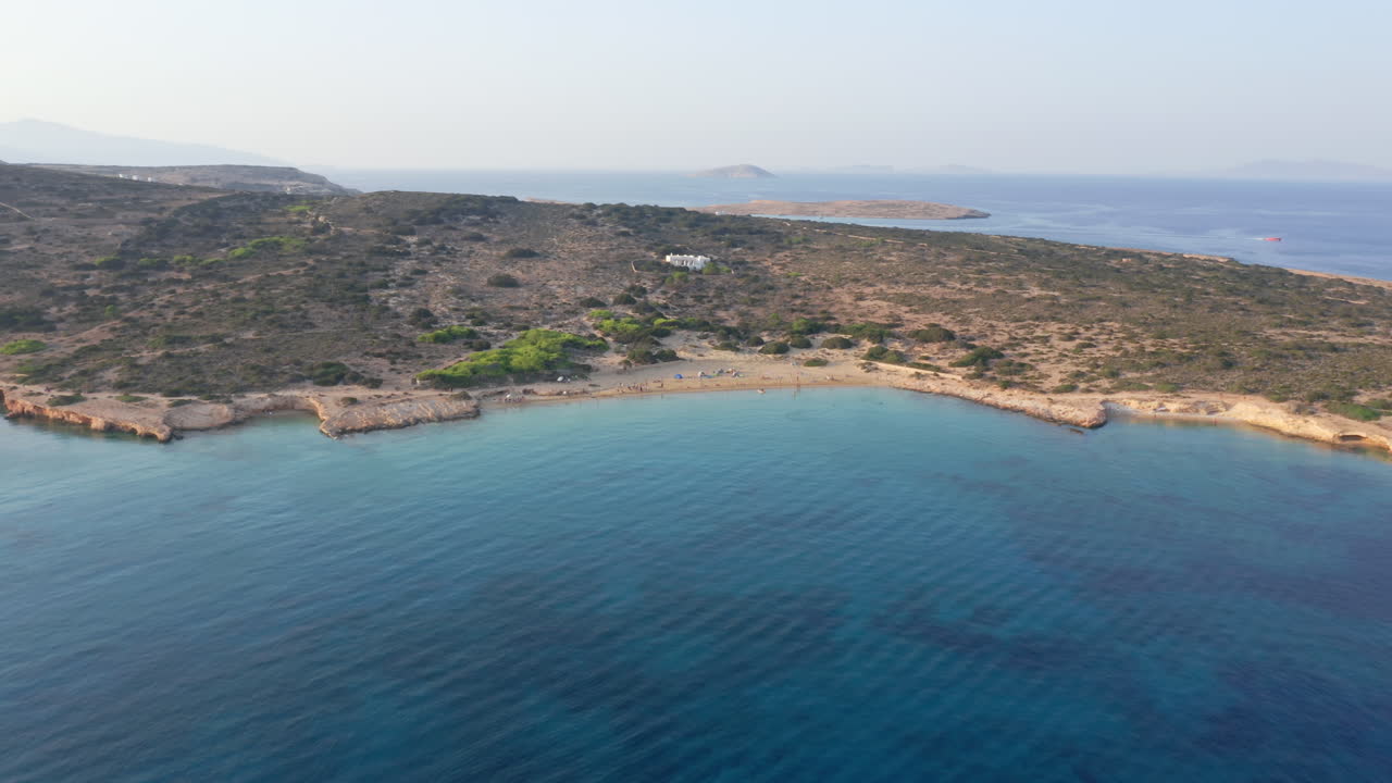 Aerial establishing of calm Italida Beach coastline and shoreline on Koufonisia, Cyclades Islands