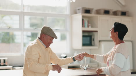 Senior-couple,-dance-and-celebration-in-kitchen