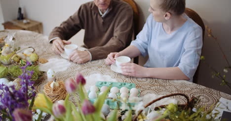 happy easter grandfather talking with granddaughter 3