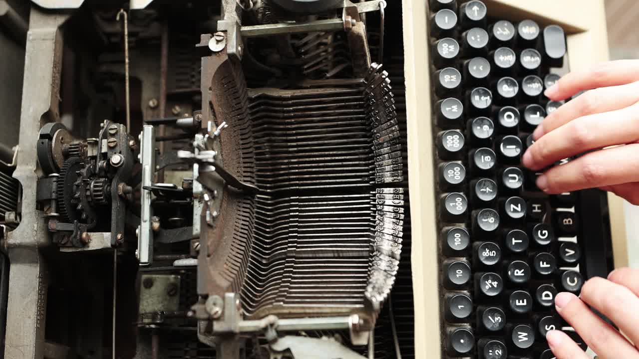 Top View Of A Person Typing On Old And Rusty Manual Typewriter