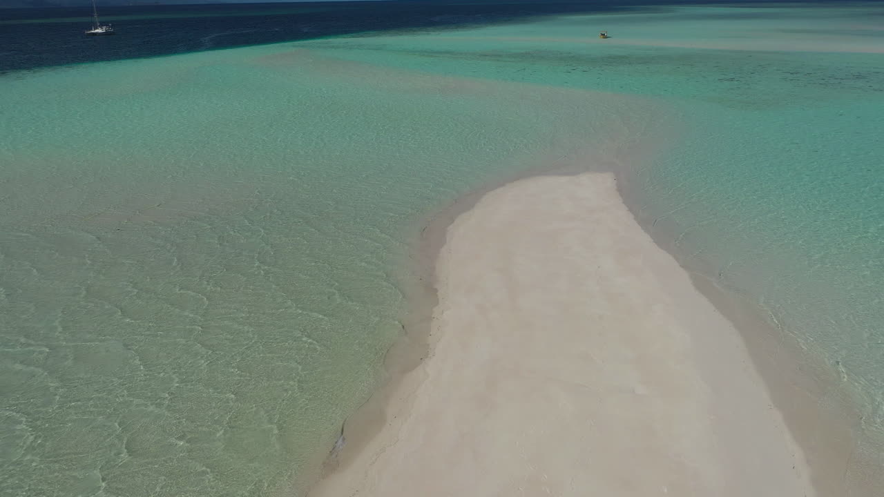 Man Walking on a Tropical Sandbar