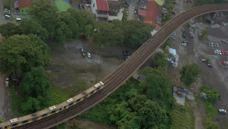 railway with a passing train in city of kuala lumpur malaysia