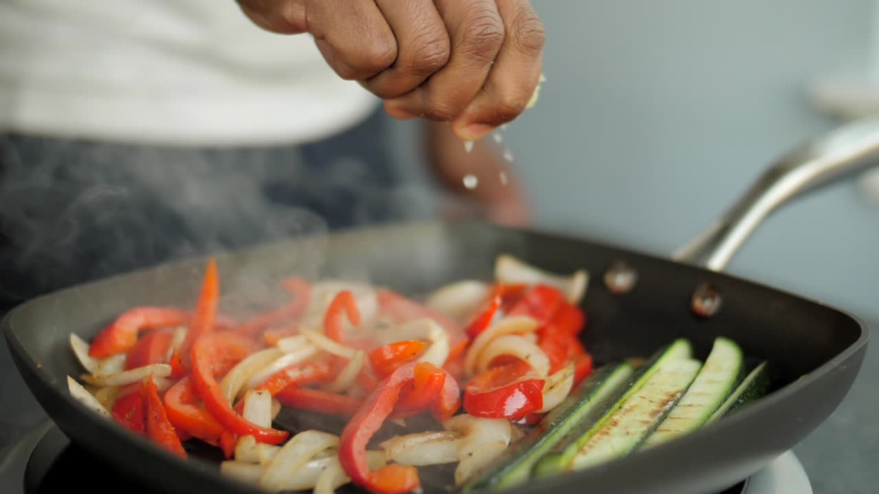 Slow motion lime squeeze over peppers