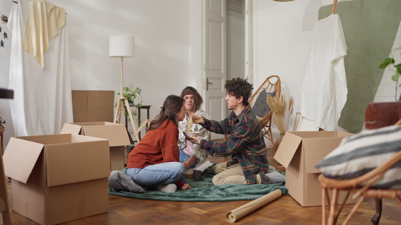 Friends Enjoying Food During a Move