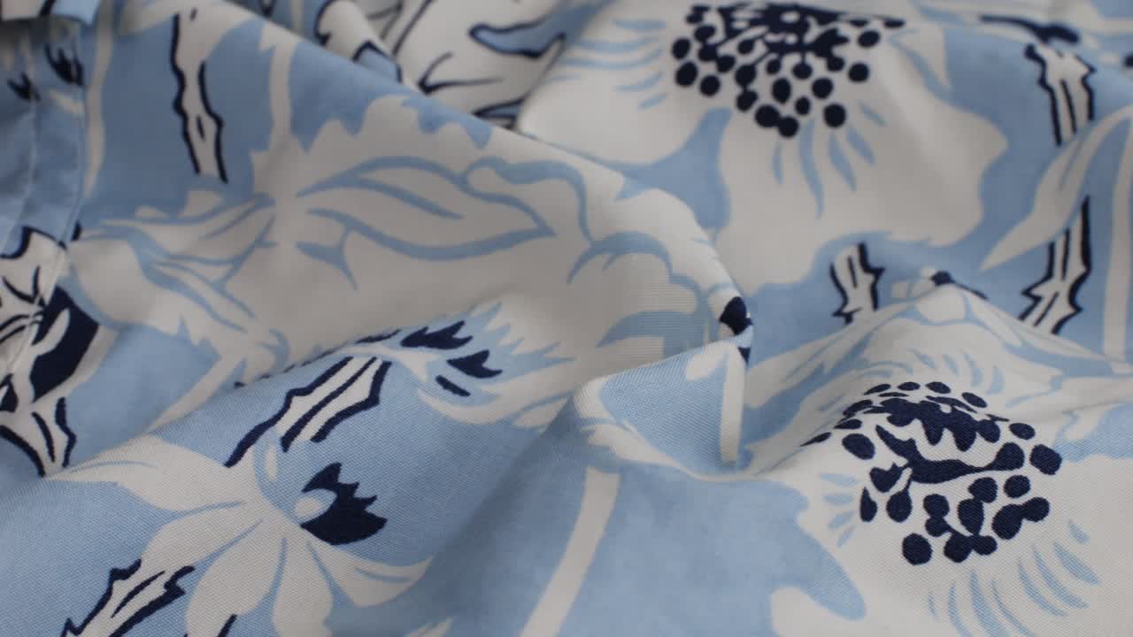 Colorful textile cloth texture close-up macro. Floral print. Fashion fabric multicolor.