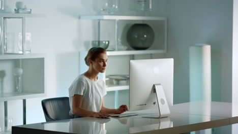 successful lady writing email. interior designer working on computer in office.