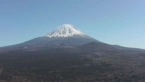 Mount-Fuji,-Clear-view-of-Volcanic-snow-capped-peak-in-Japan-over-Aokigahara