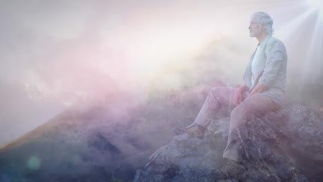 man sitting on rocks