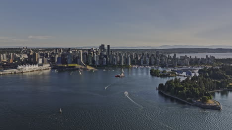 vancouver bc canada aerial v39 drone flyover the harbour capturing waterfront downtown cityscape on the skyline with towering skyscrapers against blue sky - shot with mavic 3 pro cine - july 2023