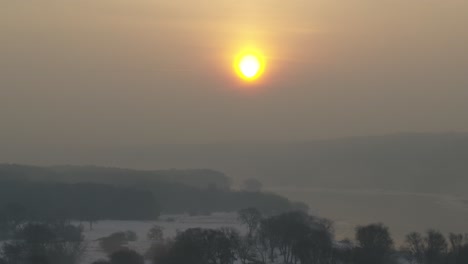 aerial view of lithuania nature in a misty sunrise. cold winter morning